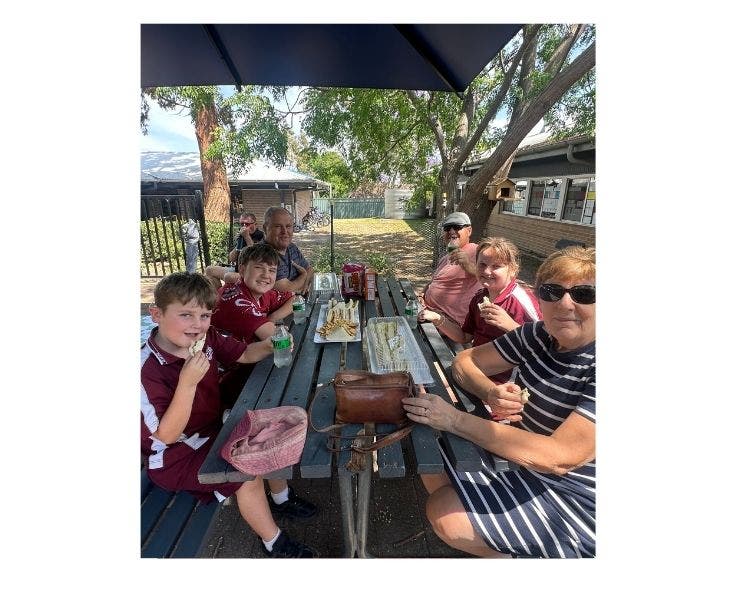 Grandparent's sharing a picnic lunch with our students.