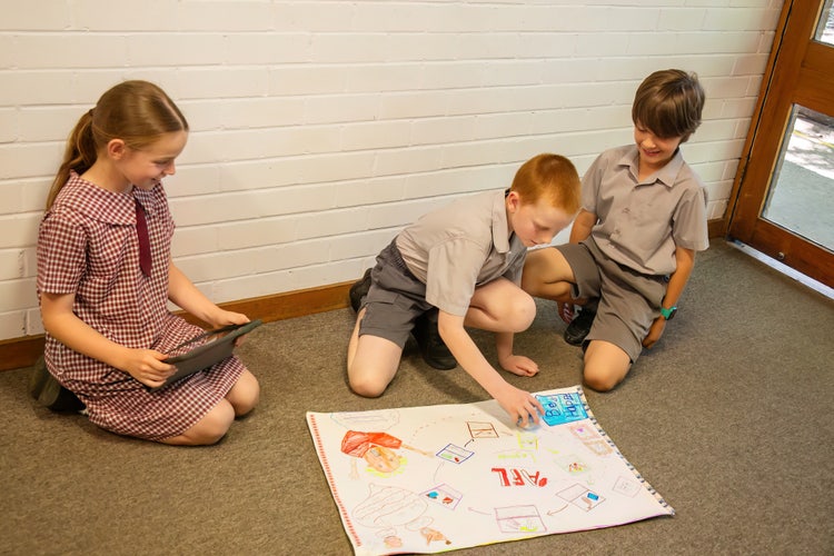 Three students working together